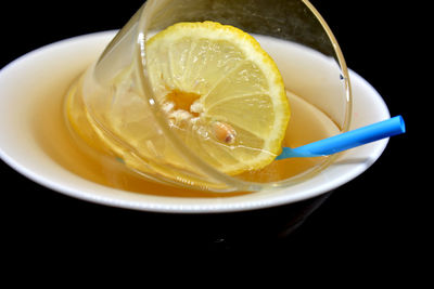 Close-up of lemon in glass