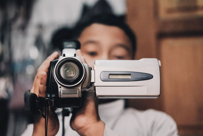 Boy recording video with camera