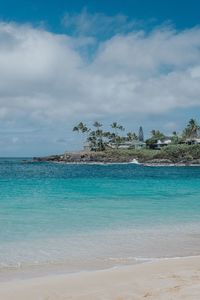 Scenic view of sea against cloudy sky