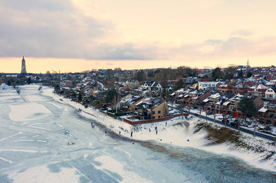 Aerial from the snowy city rhenen in the netherlands in winter