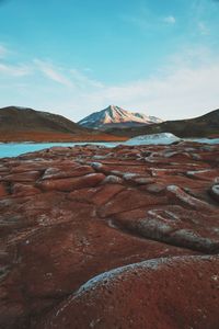 Rocky landscape with mountain in background