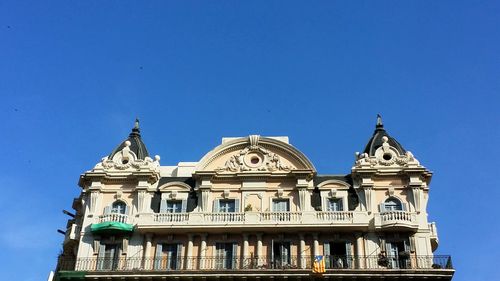 Low angle view of church against blue sky
