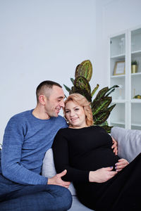 Loving couple rejoices in pregnancy expecting a baby