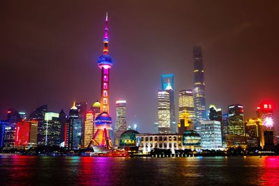 Illuminated buildings in city at night