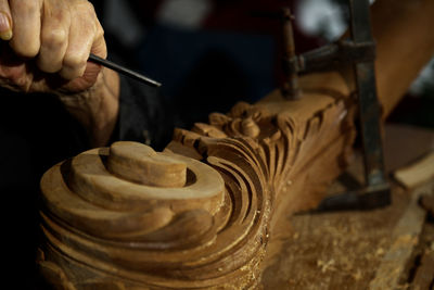 Midsection of man working at workshop