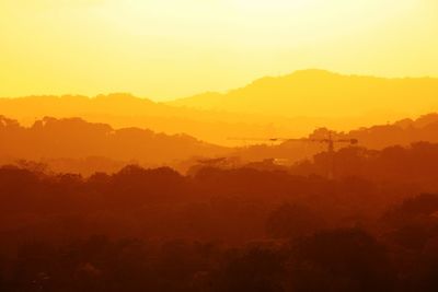 Scenic view of silhouette landscape against sky during sunset