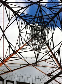 Low angle view of rollercoaster against sky