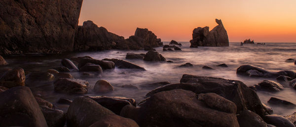 Scenic view of beach during sunset