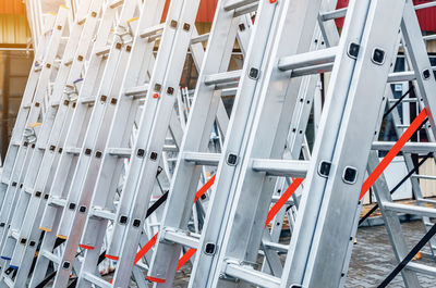 Folding metal aluminum ladders installed in row for sale