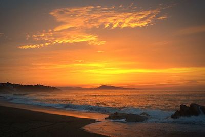 Scenic view of sea at sunset