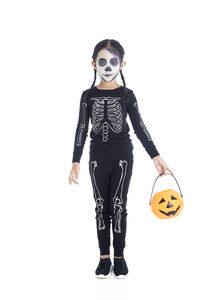 Full length of a girl wearing mask against white background