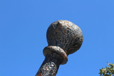 Low angle view of tree against clear blue sky