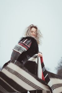 Smiling woman in traditional clothes in winter portrait picture