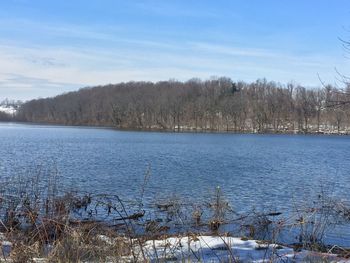 Scenic view of frozen lake against sky