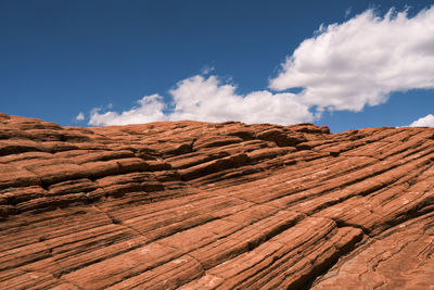 Scenic view of rock formations against blue sky