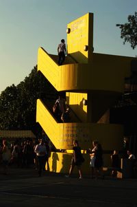 Man and woman standing in park