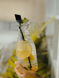 Close-up of hand holding drink