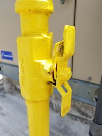 Close-up of yellow machine part