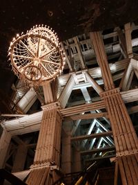 Low angle view of illuminated ferris wheel in city