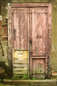 Closed door of old abandoned house