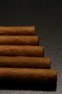 Close-up of cigar on table