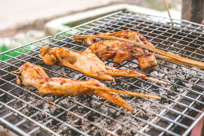 Close-up of meat on barbecue grill