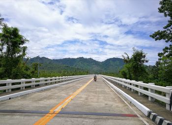 View of bridge against cloudy sky