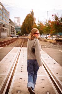 Portrait of young woman walking on street