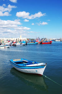 Boats moored at harbor