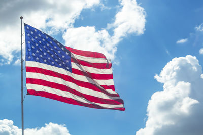 Low angle view of flag against sky