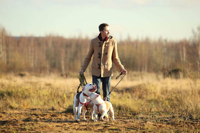 Man with dog on field