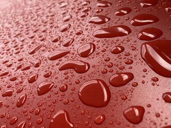 Water on red background