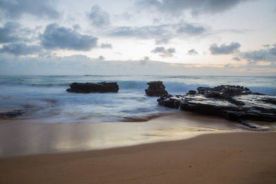 Scenic view of beach against sky