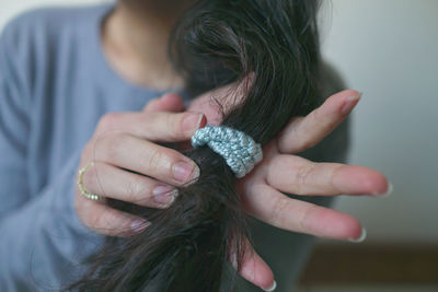 Midsection of woman holding plant