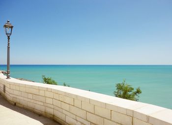 Scenic view of sea against clear blue sky