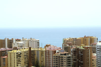 High angle view of cityscape against sea