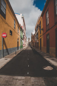 Street amidst residential buildings