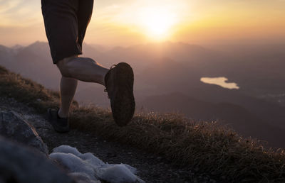 Hiker running on sauling mountain peak