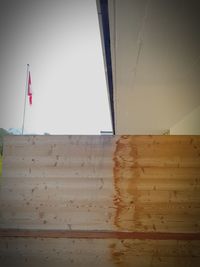 Low angle view of flag on wall
