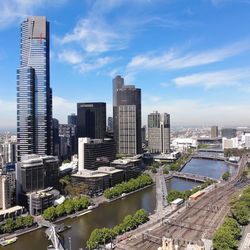 High angle view of buildings in city against sky