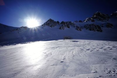 Scenic view of snowcapped mountains against sky