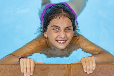 Portrait of smiling girl in swimming pool