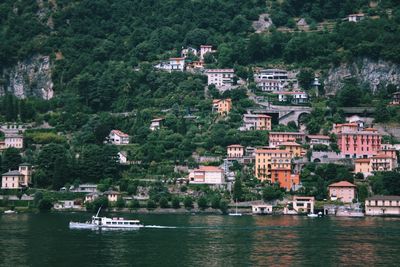 Scenic view of river by town