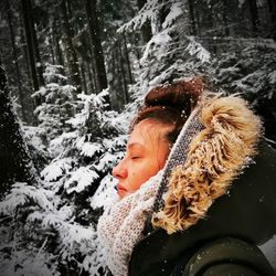 Portrait of woman on snow covered land