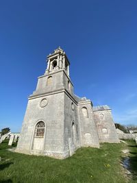 Low angle view of historic building against clear sky