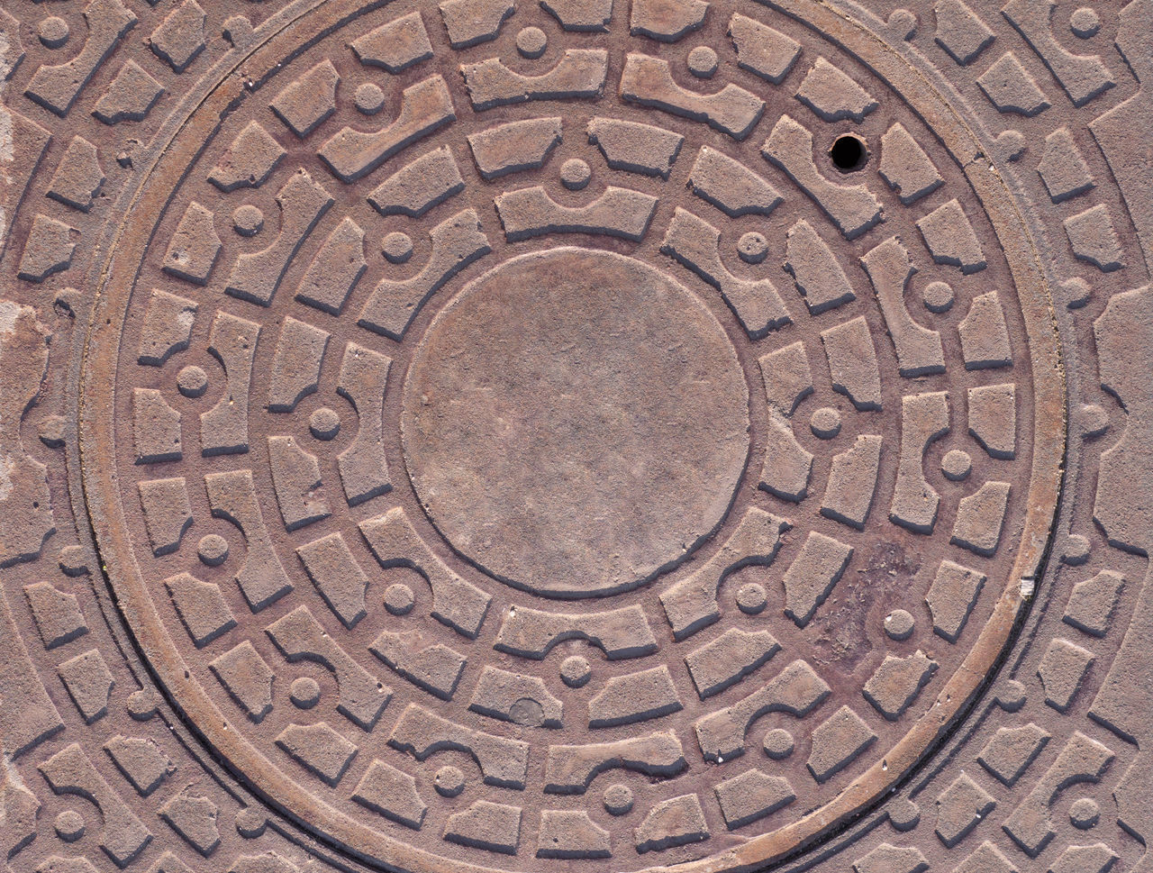 DIRECTLY ABOVE SHOT OF MANHOLE