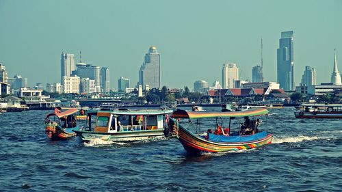 Boats sailing in river