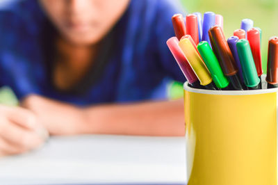 Close-up of colored pencils on table