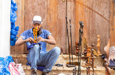 Side view of man using mobile phone