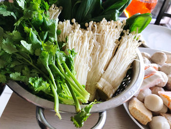 High angle view of food in colander on table